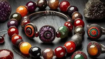 O BRATARA DIN PUETRE SEMIPRETIOASE CU BRATARA DIN METAL PE CARE ESTE SCRIS ARIES